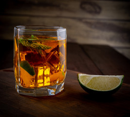 Alcoholic cocktail with whiskey lime and ice - 297086921
