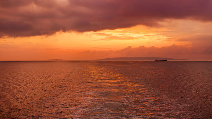 Fototapeta na wymiar sunset over the sea and island