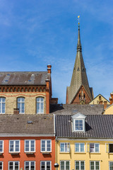 Obraz premium Colorful houses and church tower in Flensburg, Germany