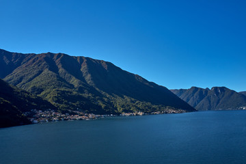 Panoramic top view of Lake Como. Lombardy, Italy. Autumn season. Perfect clear blue sky.