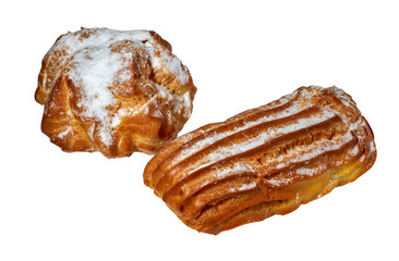 Tasty cake and eclair sprinkled with powdered sugar isolated on white background.