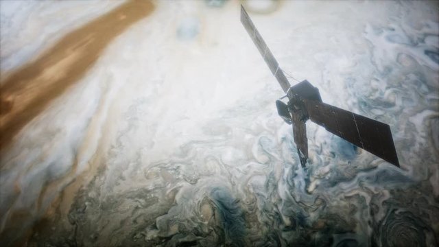 Juno sattelite orbiting Jupiter. Elements of this image furnished by NASA