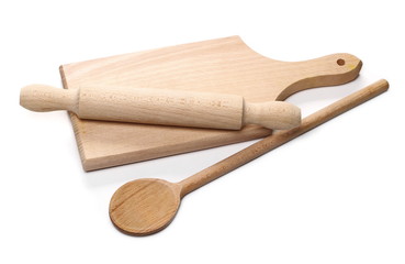 Wooden rolling pin, chopping board and spoon isolated on white background 