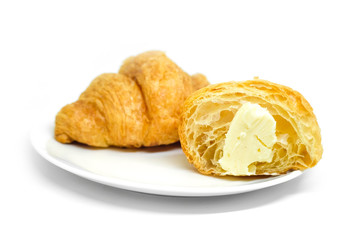 Fresh croissant in plate on white Background.Tasty buttery croissants.