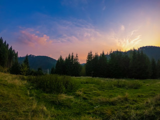 Landscape with Carpathian mountains during the sunset with amazing sunlight