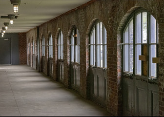 ong corridor walled whit arched window panels