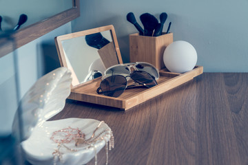 women's accesories on dressing table