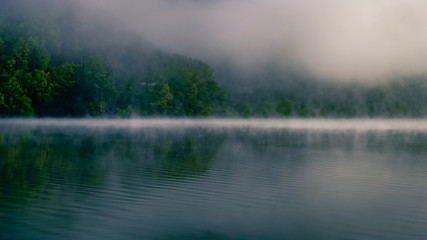 Obraz na płótnie Canvas Morning mist rising off a lake in Korea