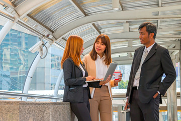 Businesspeople using laptop for consulting about his project wit