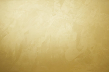 golden decorative plaster texture with glow, photo