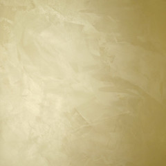golden decorative plaster texture with pearl glow