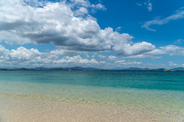 Fototapeta na wymiar The view of transparent blue waters on Paradise Island