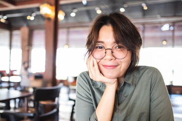 Closeup of young Asian woman with blur background.