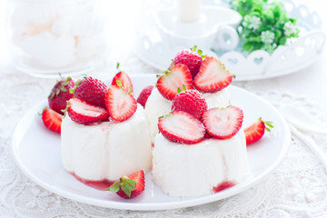 italian dessert panna cotta with fresh strawberries, horizontal
