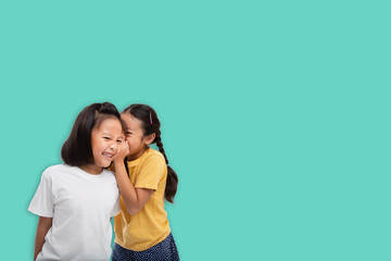 Little asian two girls laughing and smiling enjoy friendship together isolated from background