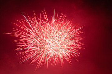 Bright red and white fireworks against the backdrop of the night sky, Vittorio Veneto, Italy