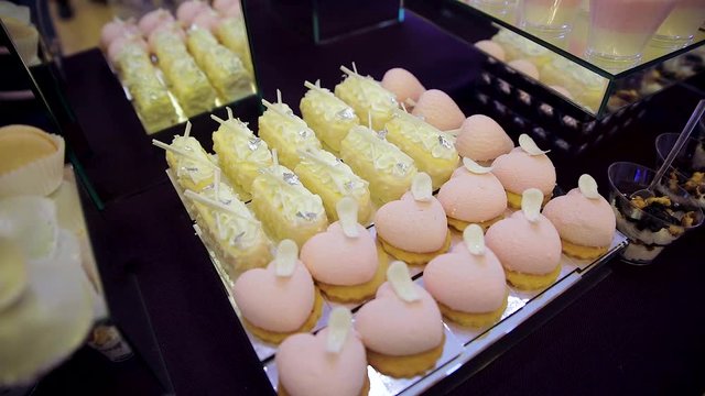 sweet table. white chocolate. mousse. sweet snacks with white chokolate hearts. serving