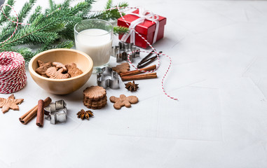 Obraz na płótnie Canvas Christmas gingerbread cookies with glass of milk
