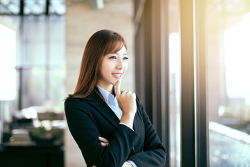 young beautiful business woman standing in office