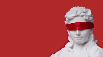 Close-up of lady justice with red blindfold. Panoramic image with copy space. - obrazy, fototapety, plakaty