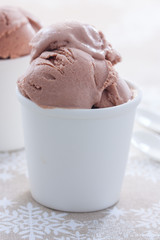 Homemade chocolate ice cream made from sour cream and condensed milk in white cups, selective focus