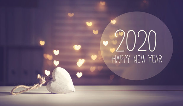 New Year 2020 message with a white heart with heart shaped lights