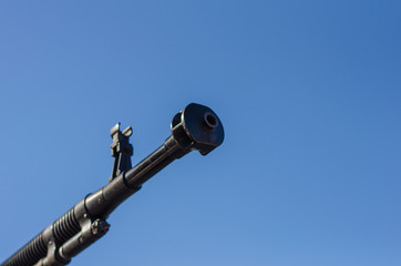 Heavy machine gun barrel against the sky