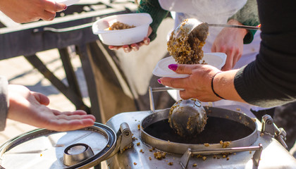 preparing a meal in the kitchen of field and feeds people on the street.