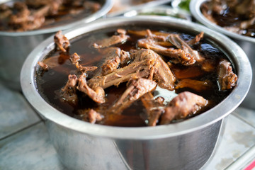 Chinese stewed duck in pot with various duck sauce