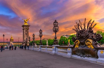 Cercles muraux Pont Alexandre III Pont Alexandre III bridge over river Seine and Hotel des Invalides on background at sunset in Paris, France