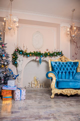 Fototapeta na wymiar New Year's decor of a living room. Christmas. Holiday room decorations.