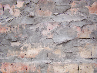 Brick wall with smeared cement mortar for background.