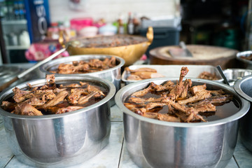Chinese stewed duck in pot with various duck sauce