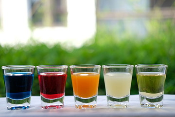 cocktail shot glass on bar counter