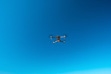 Drone is flying, drone is waiting for flight, sky is clean blue