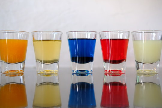 three glasses of different drinks