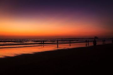 Fototapeta na wymiar Panoramic shot of a beautiful colorful sunset at the beach