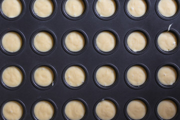 cupcakes dough, ingredients (fresh baked goods, eggs, flour, sugar, and more) menu concept. food background. copy space. Top view