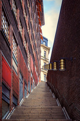 Narrow stairway among the walls