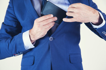 man hand phone in pocket