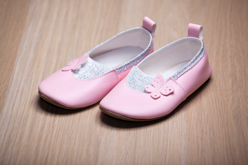 children shoes wooden table background 