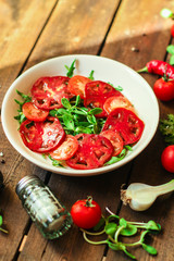 healthy salad tomatoes (vegetables, onions, greens, lettuce, sunflowers, microgreens and more) menu concept. food background. copy space. Top view