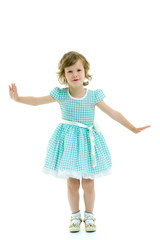A cheerful little girl is dancing.