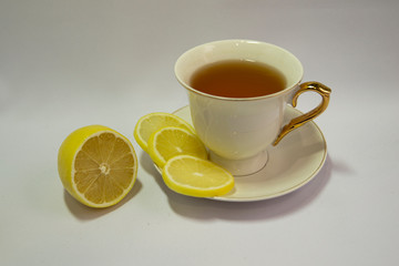 Porcelain white tea Cup isolated on white background. Limon. Tea party. Prevention of colds.