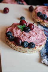  cream, blueberries and gooseberries on toasts
