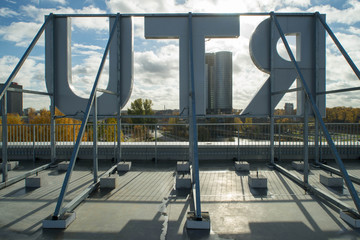 Rear view of letters on the rooftop. Autumn in the city.