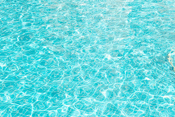 abstract ripple Water in swimming pool with sun reflection