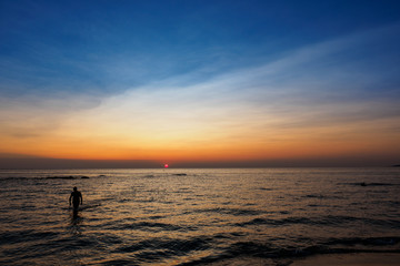 Scenic view of a summer sunset on the Ionian sea near Gallipoli, a town in the Apulian region (Italy). Landscape format.