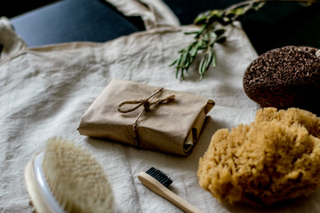 eco natural bamboo toothbrushes in glass on rustic background with greenery. sustainable lifestyle concept. zero waste home. bathroom essentials, plastic free items