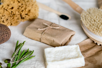 eco natural bamboo toothbrushes in glass on rustic background with greenery. sustainable lifestyle concept. zero waste home. bathroom essentials, plastic free items